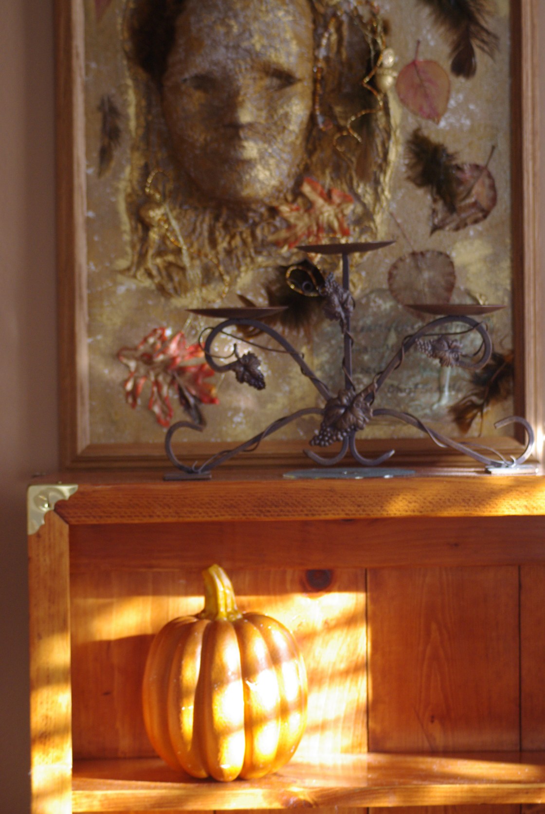 Another view of hutch shows a pumpkin and part of my mixed media art using masks.